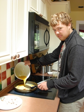 Jordan cooks us up an omelette with his special sauce. (Photo © Kim Goldberg 2013)